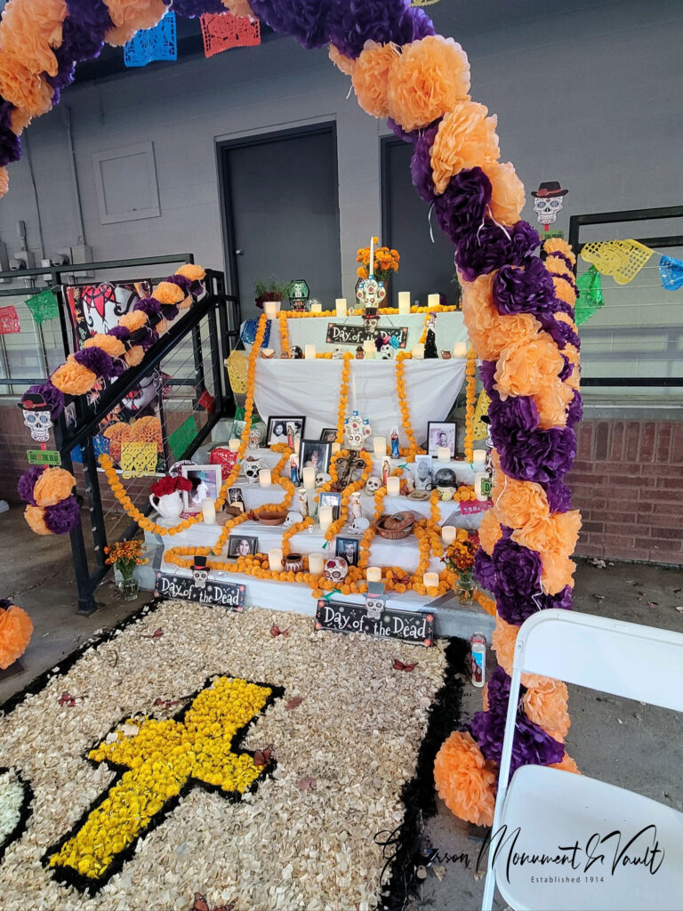 The ofrenda at the Downtown Springdale Dia de Muertos celebration is beautifully adorned with colors and offerings